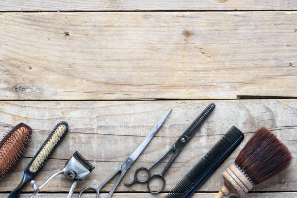 istock Old vintage barbershop tools on wooden table 977560000