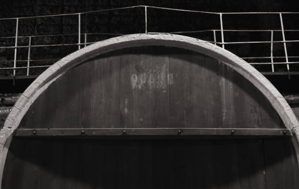Fragment of old wooden barrel in dark Fragment of old wooden barrel in dark winery, monochrome inkerman stock pictures, royalty-free photos & images