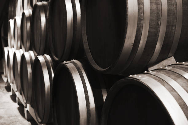 Wooden barrels in winery, close up photo Wooden barrels in winery, close up monochrome photo with selective focus inkerman stock pictures, royalty-free photos & images