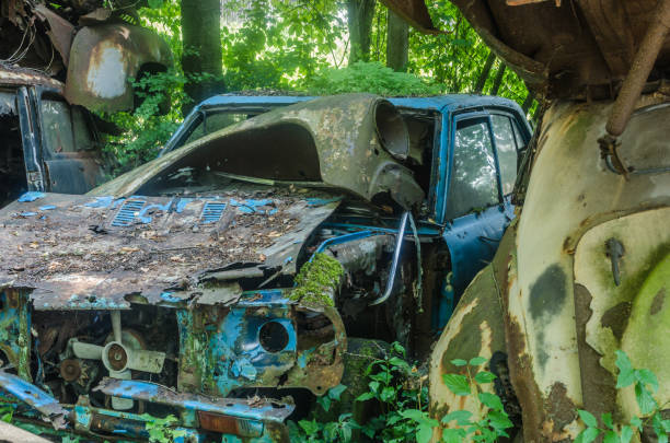 istock Blue car on junkyard 977586568