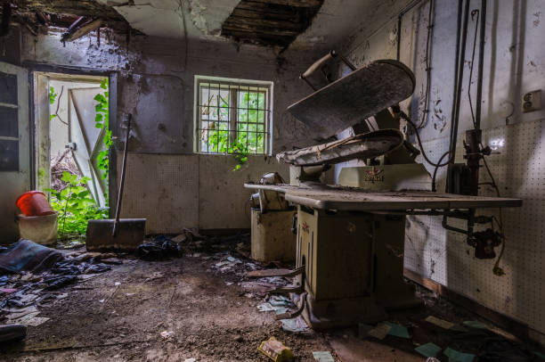 istock ironing station in a decayed house 977590890