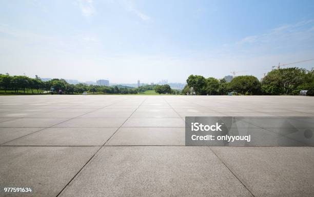 An Empty Floor In A City Park Stock Photo - Download Image Now - Sidewalk, Flooring, Concrete