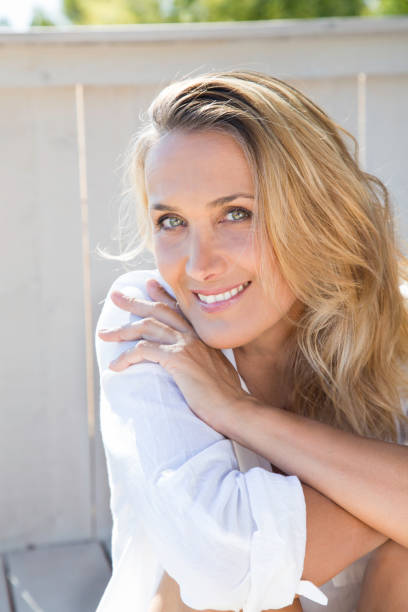 istock smiling woman of 40 years 977602644