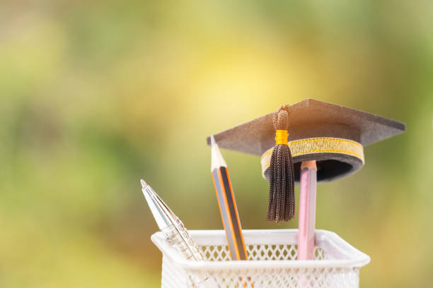 istock Graduate study or Education knowledge is power concept: Graduated cap Put on color pencil in basket. Conceptual for Educational is successs study or business world. Back to School ideas. 977616892