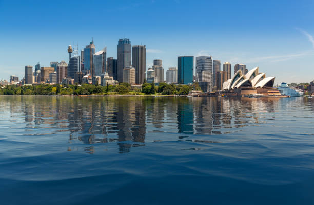 Dramatic panoramic photo Sydney harbor Dramatic widescreen panoramic image of the city of Sydney from Taronga Zoo  with artificial water in the harbour sydney harbor photos stock pictures, royalty-free photos & images