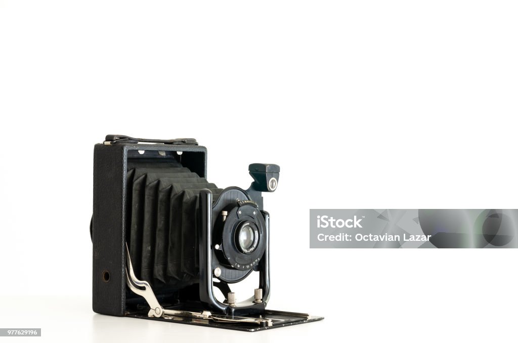 Vintage folding camera Black vintage folding bellows film camera isolated against a white background Bellows Stock Photo