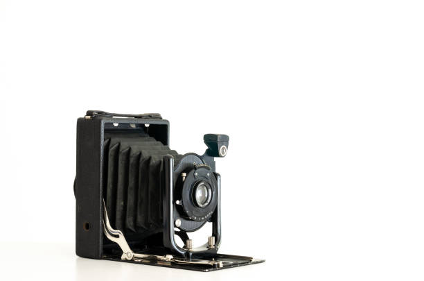 Vintage folding camera Black vintage folding bellows film camera isolated against a white background bellows stock pictures, royalty-free photos & images