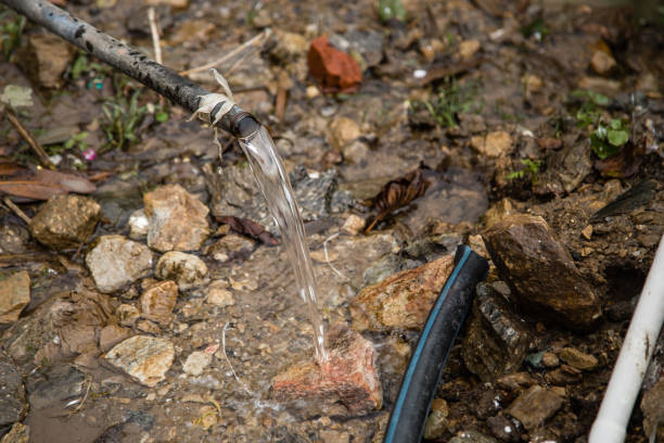 istock Water Flowing Out Of Pipe 977631508