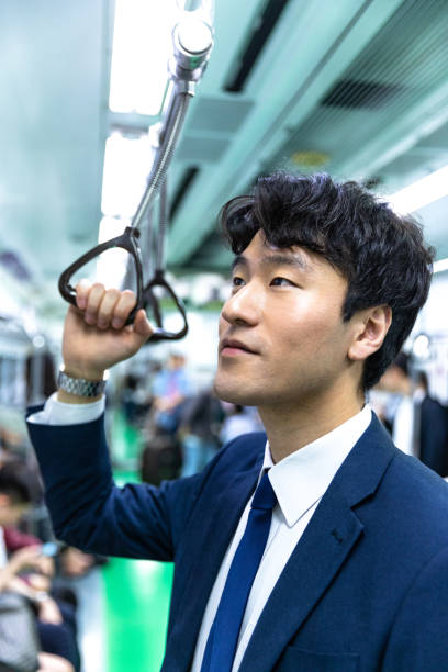 istock Businessman commuting by train in Seoul - South Korea 977645038