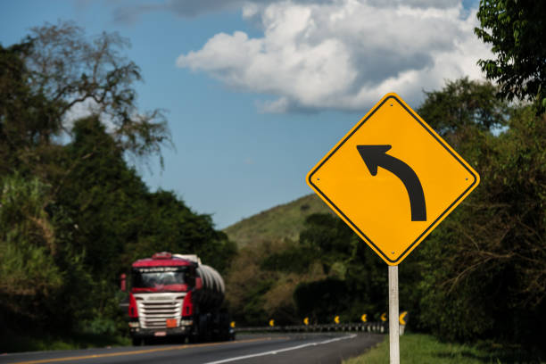 Road sign, left turn, highway BR-116, Barra do Piraí, RJ Brazil