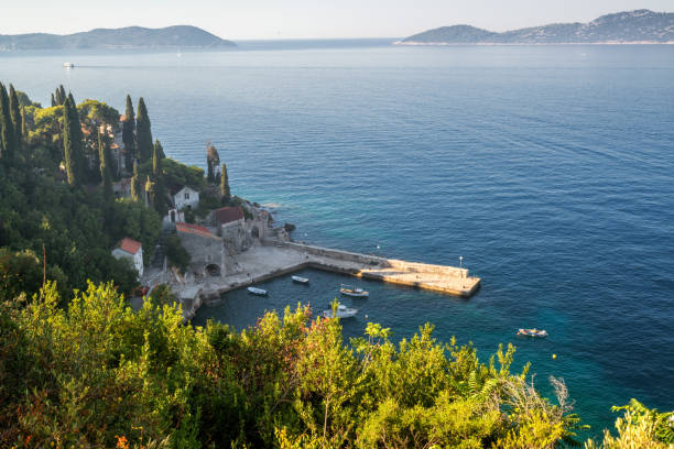 istock Adriatic coast with harbor in Trsteno, Croatia. 977670996