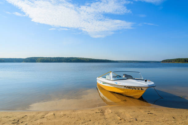 Mountain lake Batak and boat. Bulgaria, Balkans, Eastern Europe.
