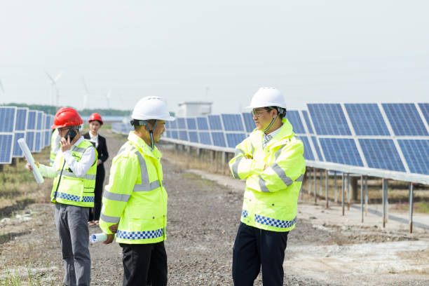 istock Large photovoltaic power stations and engineers in China 977674486