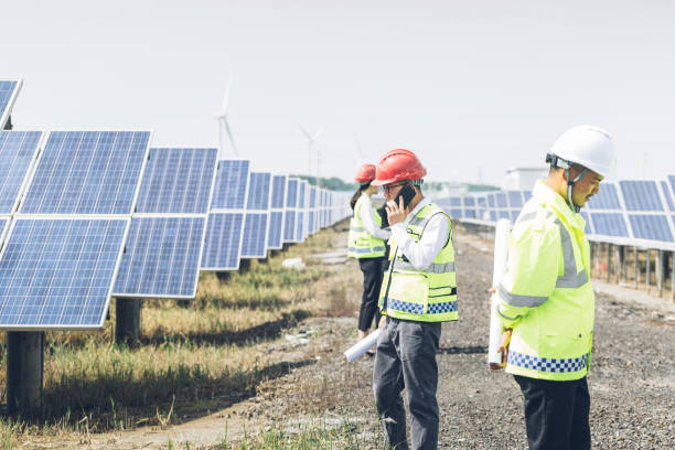istock Large photovoltaic power stations and engineers in China 977674588