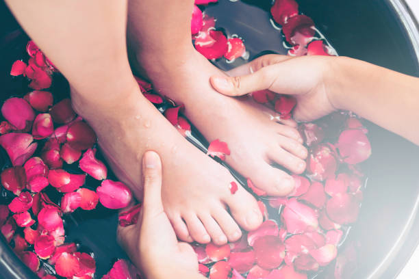istock Foot spa massage treatment in luxury spa resort. 977684408