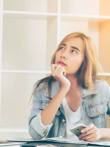 istock Creative woman thinking or planning in the office. 977684534