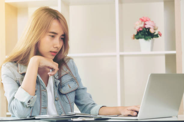 istock Creative woman thinking or planning in the office. 977684564