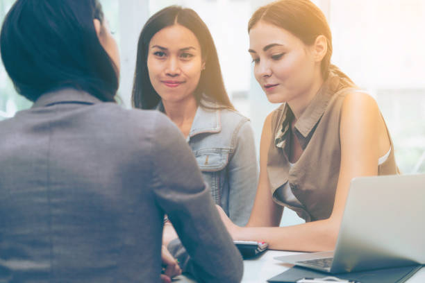 istock Multicultural businesswomen in group meeting. 977684618