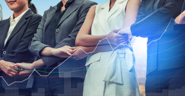 istock Double exposure business people holding hands. 977691440