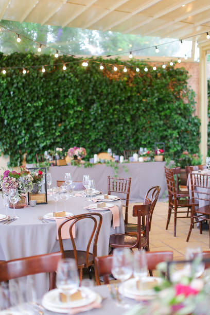 istock Decorated and served tables for banquet at cafe in open air 977712700