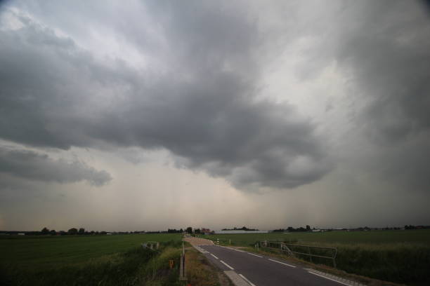 istock Dark thunderstorm clouds above reclaimed land named zuidplaspolder, which is the lowest area of the netherlands 977718410