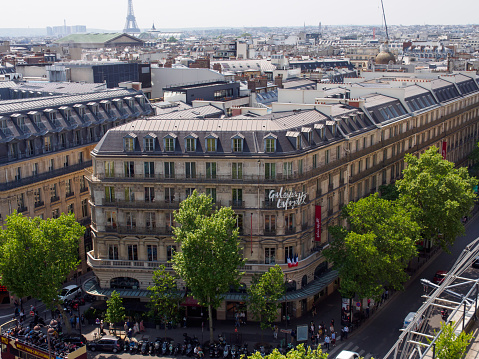 PARIS, FRANCE - MAY 9, 2018: Wide angle aerial view of the famous Galeries Lafayette department store on a sunny day. Boulevard Haussmann, 9th arrondissement.