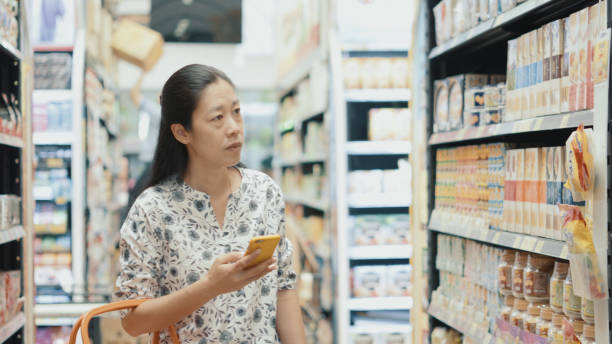 istock Woman finding product inside supermarket 977720964
