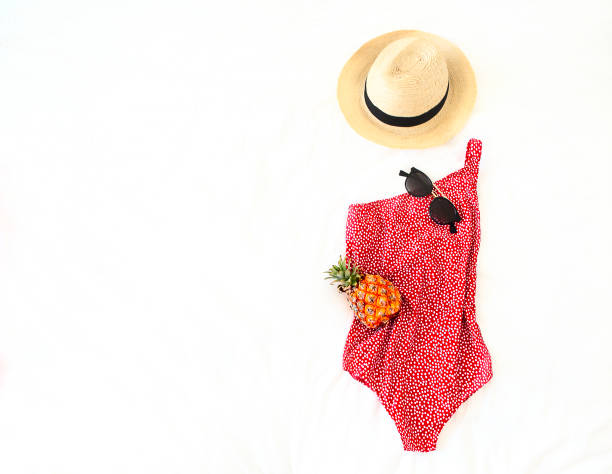 istock Summer vacation concept with swimwear sunglasses hat and pineapple 977721924