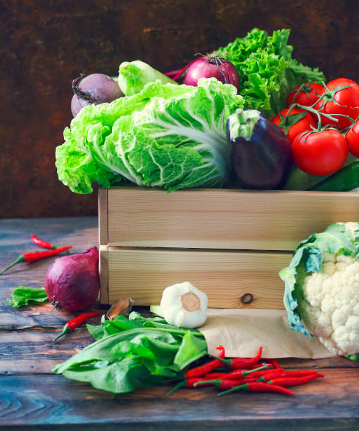 organic raw vegitables in wooden box. healthy diet and nutrition concept - vegitables imagens e fotografias de stock