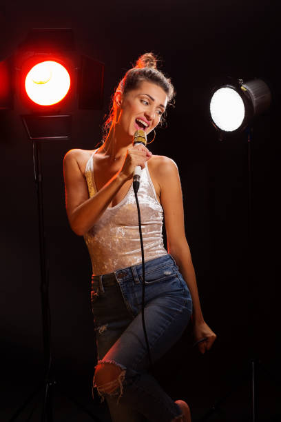 istock A woman sings a song in the studio 977725036