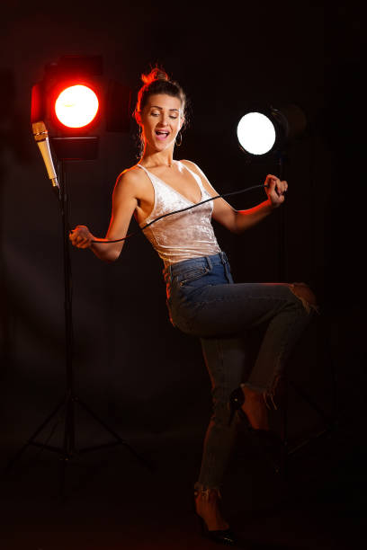 istock A woman sings a song in the studio 977725050