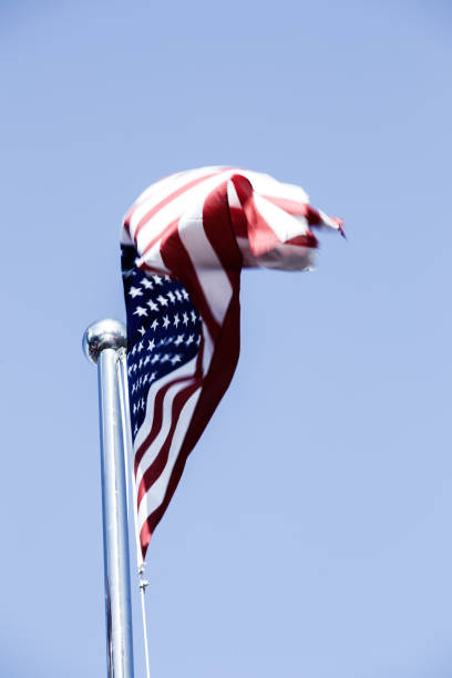 istock American Flag Blowing in the Wind 977759174