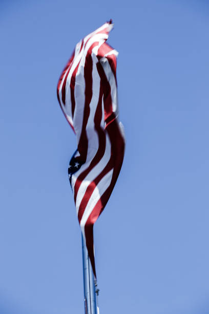 istock American Flag Blowing in the Wind 977759278
