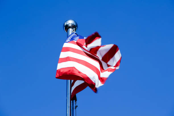 istock American Flag Blowing in the Wind 977759494