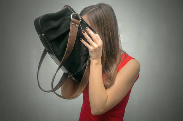 Woman in red dress. Disgruntled girl forgot her wallet with the money at home. Not enough money for shopping. The lost wallet concept. money shortage stock pictures, royalty-free photos & images