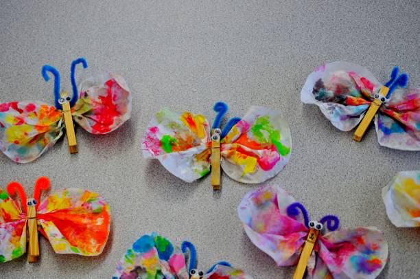 istock Colorful butterflies. Art projects made by small children. 977812356