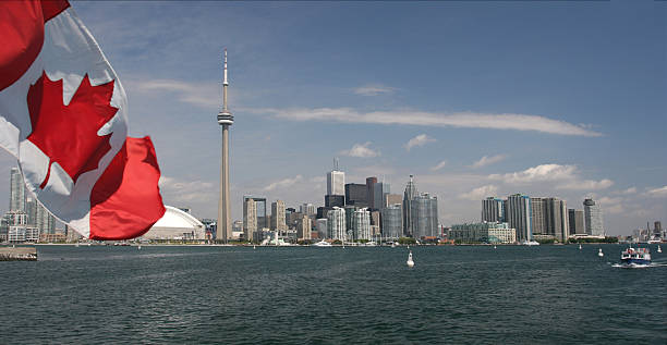 istock Canadian flag and Toronto skyline 97781365