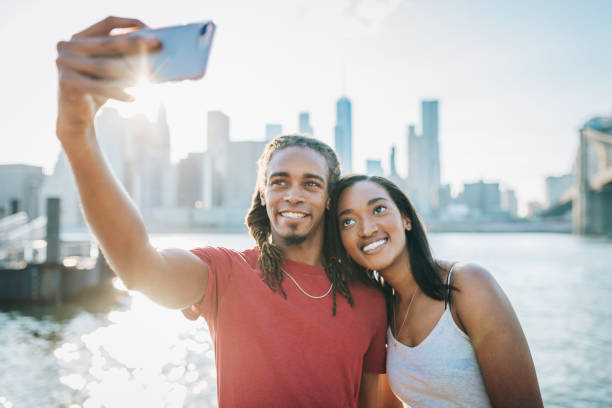 istock Couple taking selfie in summer near Manhattan 977821364