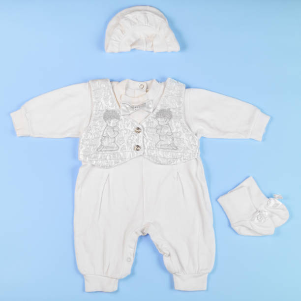 istock Overall for a newborn baby on a blue background 977823348