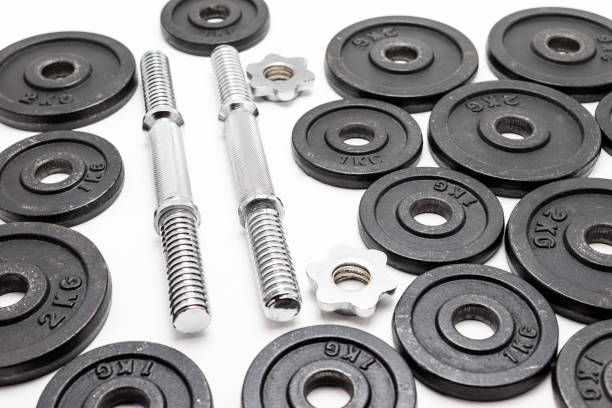 istock Black metal weights 1kg and 2kg on white background. 977834990
