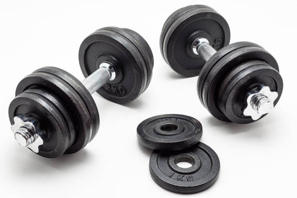 istock Black metal dumbbells on white background. 977835072