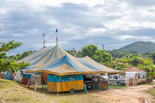 Sao Goncalo - State of Rio de Janeiro - June 3rd, 2010: Very simple circus mounted in a poor district of the poor city of São Goncalo, about 50 km away from Rio de Janeiro. The blue and yellow trailler is the ticket office.