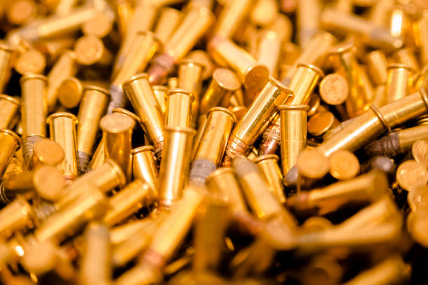 istock Closeup pile of bullets center 977850190