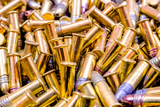 istock Closeup pile of bullets shiny 977850684