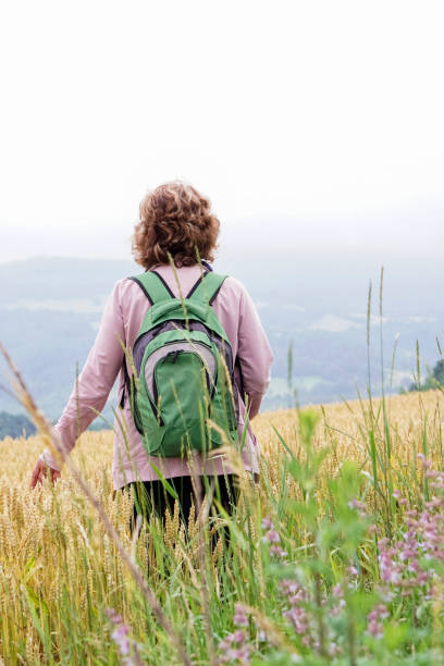 istock Senior woman hiking on mountain 977874874