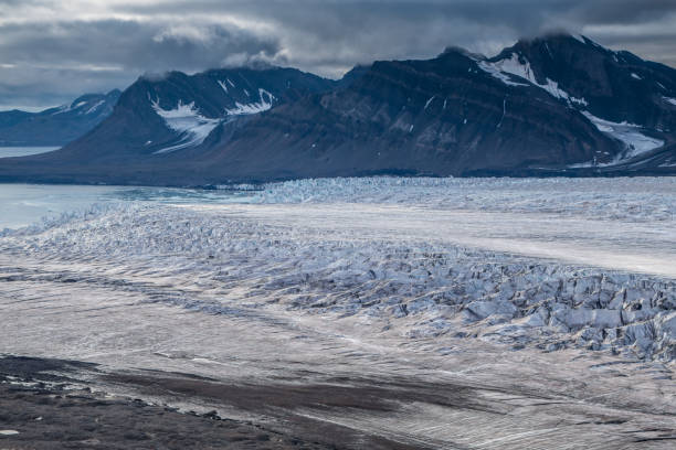istock Glacier tongue in a cloudy day near Longyearbyen, Svalbard 977925286
