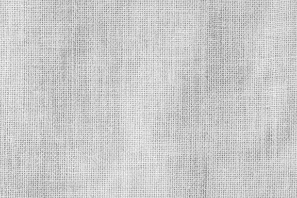 sfondo motivo texture intrecciato sacco dell'assia in colore grigio chiaro - gauze textile gray textured foto e immagini stock