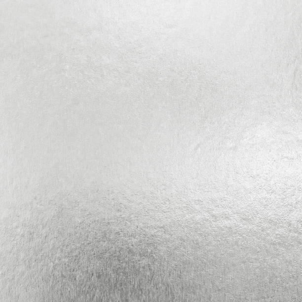 istock Silver foil shiny metallic texture background wrapping paper for Christmas and holiday wallpaper design decoration element 977976636