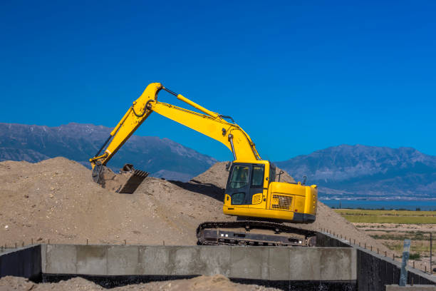 istock Tractor sitting in front of Utah Valley mountains 977988528