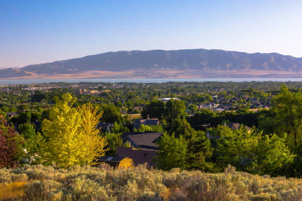 Utah lake with mountains and city surrounding Views of Mormon Temple with Utah Lake in thebackground of Utah Valley lake utah stock pictures, royalty-free photos & images